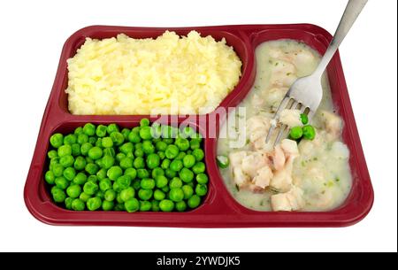 Kabeljau in Petersiliensauce Fertigmahlzeit mit Kartoffelpüree und grünen Erbsen in einer aufgeteilten Kunststoffschale Stockfoto