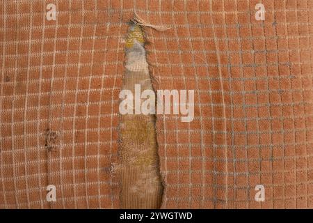 Gerissene beige Stuhlpolsterung, Nahaufnahme, abstrakte Textur Stockfoto