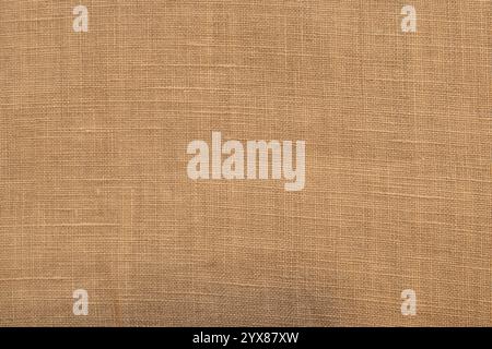 Beige Leinenstoff Textur Closeup als textiler Hintergrund Stockfoto