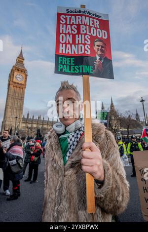 London, Großbritannien. Dezember 2024. Pro-palästinensische Unterstützer protestieren gegen Israels anhaltende Angriffe auf Gaza. Als sich Tausende pro-palästinensischer Demonstranten auf dem parlamentsplatz versammelten, stellte sich ein Gegenprotest der pro-israelis ihnen gegenüber, getrennt durch eine Polizeieinheit. Quelle: SOPA Images Limited/Alamy Live News Stockfoto