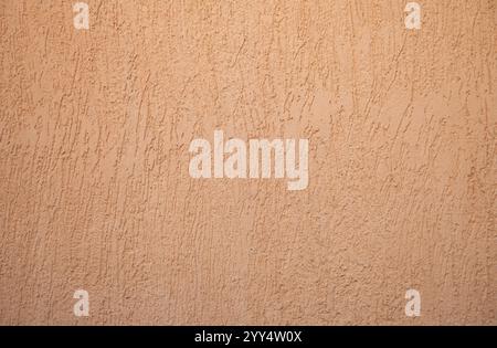 Hintergrund orange verputzte Wand mit Textur Stockfoto