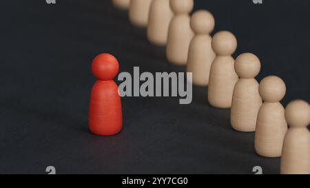 Eine Holzfigur, die mit einem Team steht, um Einfluss zu nehmen und zu ermächtigung. Konzept der Führung, erfolgreicher Wettbewerbssieger und Leader mit Einfluss und Stockfoto