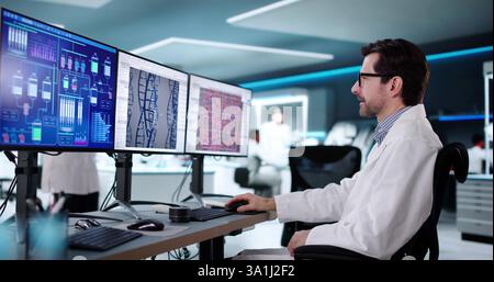 Wissenschaftlerin, die Biotechnologie im Labor mit fortschrittlicher Computertechnologie erforscht. Stockfoto
