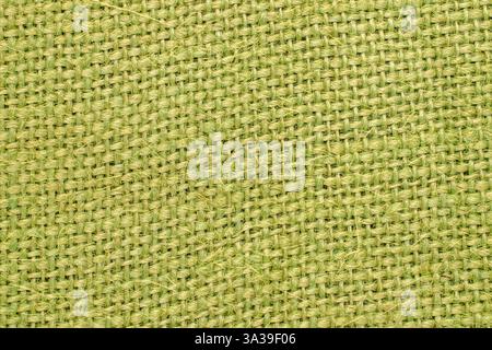 Ein Stück Jute-Stoff, grün gefärbt, Makro. Stockfoto