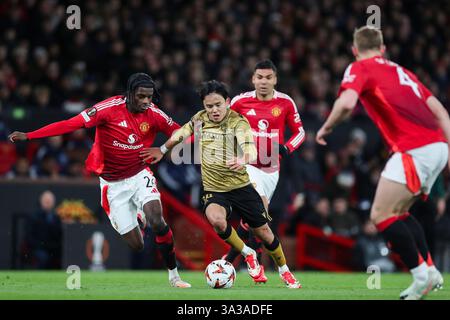 Manchester, Großbritannien. März 2025. Real Sociedad Mittelfeldspieler Takefusa Kubo (14) während der Achtelrunde der UEFA Europa League Manchester United FC gegen Real Sociedad, 2nd Leg Match in Old Trafford, Manchester, England, Vereinigtes Königreich am 13. März 2025 Credit: Phil Duncan/Every Second Media Credit: Every Second Media/Alamy Live News Stockfoto