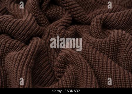 Braune Pullover-Textur als Hintergrund. Draufsicht. Stockfoto