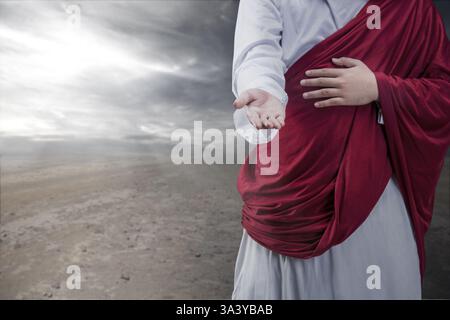 Jesus Christus streckt mit offenen Armen aus. Das Konzept von Christentum, Glauben und Spiritualität Stockfoto
