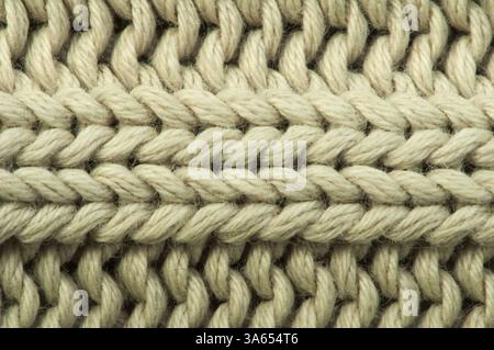 Alten Strickpullover Hintergrund. Beige Farbe. Studio gedreht Stockfoto