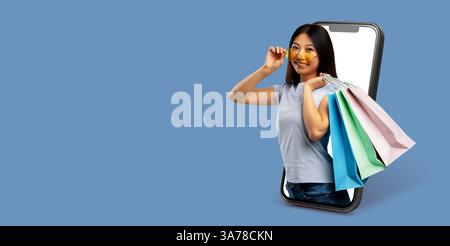 Interaktive Online-Käufer halten bunte Taschen, während sie eine Smartphone-App verwenden Stockfoto