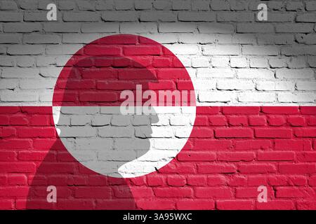 Die Flagge von Grönland ist auf der Ziegelmauer gemalt Stockfoto