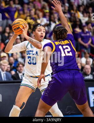 Mar 30 2025 Spokane WA U.S.A. UCLA Stürmer Timea Gardiner (30) will den Ball beim NCAA Women's Basketball Regional Elite Acht Spiel eins zwischen LSU Lady Tigers und den UCLA Bruins passieren. UCLA besiegte LSU 72-65 in der Spokane Veterans Memorial Arena, Spokane, WA. Thurman James/CSM (Bild: © Thurman James/Cal Sport Media) Stockfoto