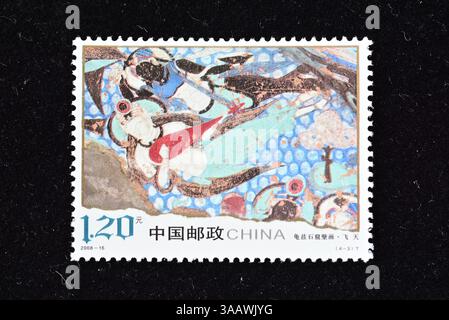 CHINA - CA. 2008: Eine in China gedruckte Briefmarke zeigt Wandgemälde der Qiuci Grottoe, ca. 2008 Stockfoto