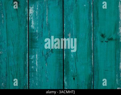 Blaue türkisfarbene verwitterte alte Holzwand mit Holzbrettern als Holzhintergrund mit Holzbrettern Stockfoto