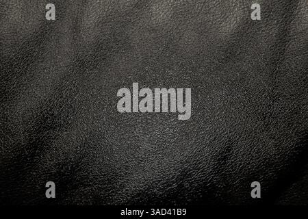 Nahaufnahme eines schwarzen Hintergrunds mit Lederstruktur und Details. Weißrussland Stockfoto