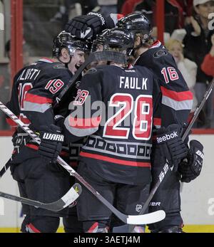 23. November 2011 - Raleigh, NC, USA - Jiri Tlusty (19) der Carolina Hurricanes feiert sein Tor mit seinen Teamkollegen Justin Faulk (28) und Brandon Sutter (16) während der ersten Phase eines NHL-Spiels im RBC Center in Raleigh, North Carolina am Mittwoch, 23. November 2011. (Foto: © Chris Seward/Raleigh News & Observer/MCT/ZUMAPRESS.com) Stockfoto