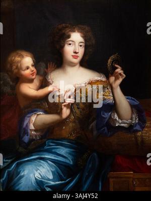 Dieses Ölgemälde von Pierre Mignard aus dem Jahr 1666-1667 zeigt Francoise-Louise de La Baume Le Blanc, Herzogin de la Valliére, als Venus. Das Porträt zeigt sie in aufwendiger Kleidung, die Schönheit und Liebe symbolisiert, mit einem ruhigen Ausdruck und einer zarten Pose. Die Szene fängt die mythologische Göttin in einer königlichen Umgebung ein. Stockfoto