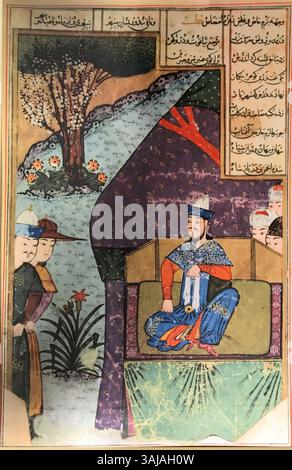 Diese Illustration aus dem Jahr 1436 aus der „Zafarnama“, einem epischen persischen Manuskript, zeigt Timur, der Gäste bei der Hochzeit seines Sohnes Jahangir empfängt. Die lebendigen Farben, das Gold und die komplizierten Details unterstreichen die Pracht des timuridischen Hofes und seine kulturelle Bedeutung im 14. Jahrhundert. Stockfoto