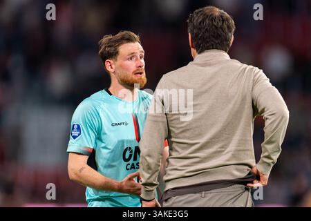 Eindhoven, Niederlande. April 2025. EINDHOVEN, NIEDERLANDE - 12. APRIL: Thomas Robinet von Almere City FC tritt am 12. April 2025 im Philips Stadion in Eindhoven (Niederlande) mit Coach Jeroen Rijsdijk vom Almere City FC zusammen. (Foto von Joris Verwijst/Orange Pictures) Credit: Orange Pics BV/Alamy Live News Stockfoto