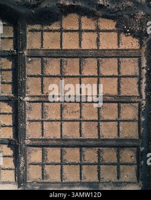 Aerial view of part of the beautiful and historic Salinas de Janubio salt pans settled along the west coast in Lanzarote, Canary Islands, Spain. Stock Photo