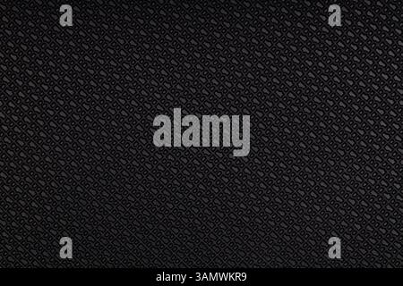 Dunkle Gummioberfläche mit geprägtem Rautenmuster Stockfoto