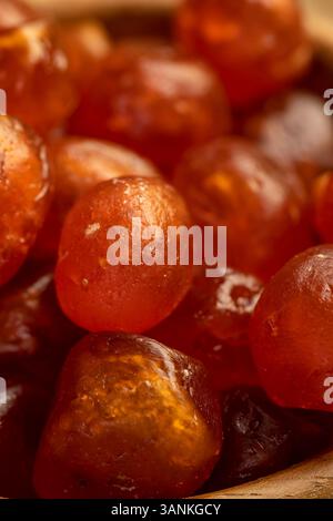 Kandiertes Kumquat, gekocht mit Zuckersirup kandierte Früchte von kleinen Früchten von Kumquat, Nahaufnahme, Seitenansicht Stockfoto