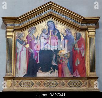 FLORENZ, ITALIEN - 19. MÄRZ 2025: Das Renaissance-Gemälde der Madonna unter den Heiligen in der Kirche Chiesa di San Salvatore al Monte Stockfoto