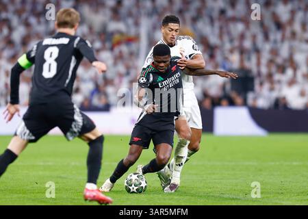 Thomas Partey vom Arsenal FC und Jude Bellingham von Real Madrid während der UEFA Champions League, Viertelfinale, 2. Legs-Fußballspiel zwischen Real Madrid CF und Arsenal FC am 16. April 2025 im Santiago Bernabeu Stadion in Madrid Stockfoto