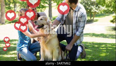 Bild von Herzen, die über glückliche Eltern schweben und Tochter streichelt Hund im sonnigen Park Stockfoto