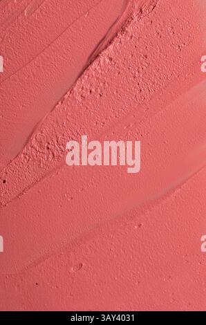 Hochauflösendes Bild mit der detaillierten Textur der rosa Kosmetikcreme, ideal für Hintergründe oder Werbeaktionen für Kosmetikprodukte. Stockfoto