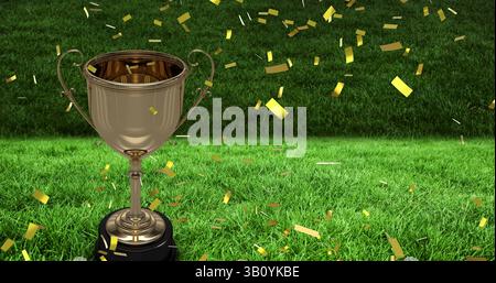 Bild von Konfetti, die über Goldbecher im Sportstadion fallen Stockfoto