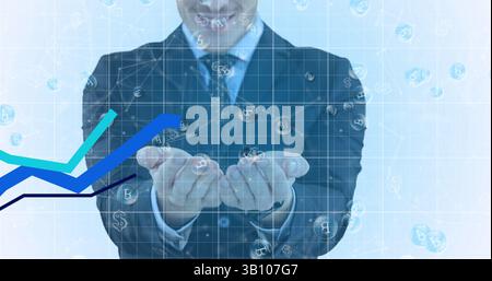 Bild der Verarbeitung von Finanzdaten mit blauen Linien und Bitcoins über dem kaukasischen Geschäftsmann Stockfoto