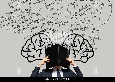 Frustrierter, gestresster Geschäftsmann, der im Büro seinen Kopf unter einem Laptop versteckt, mit Zeichnungen menschlicher Gehirne und mathematischen Grafiken und Formeln über h Stockfoto