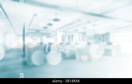 Verschwommener Hintergrund für Geschäftsgeschäfte, modernes Innendesign in Blau. Verschwommenes Bild eines modernen Bürobereichs mit einer ruhigen und offenen Atmosphäre. Stockfoto