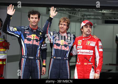 22. Oktober 2010 - Top drei im Qualifying parc Ferme (L bis R): Mark Webber (aus) Red Bull Racing, Zweiter; Sebastian Vettel (GER) Red Bull Racing, Pole Position; Fernando Alonso (ESP) Ferrari, Third...Formel-1-Weltmeisterschaft, Rd 17, Grand Prix von Korea, Qualifying Day, Korea International Circuit, Yeongam, Südkorea, Samstag, 23. Oktober 2010. (Foto: © Sutton Motorsports/ZUMApress.com) Stockfoto