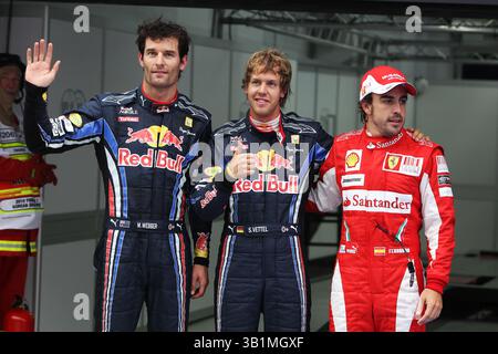 22. Oktober 2010 - Top drei im Qualifying parc Ferme (L bis R): Mark Webber (aus) Red Bull Racing, Zweiter; Sebastian Vettel (GER) Red Bull Racing, Pole Position; Fernando Alonso (ESP) Ferrari, Third...Formel-1-Weltmeisterschaft, Rd 17, Grand Prix von Korea, Qualifying Day, Korea International Circuit, Yeongam, Südkorea, Samstag, 23. Oktober 2010. (Foto: © Sutton Motorsports/ZUMApress.com) Stockfoto