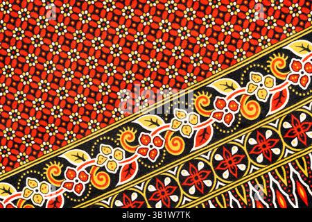Nahaufnahmebildstruktur aus traditionellem thailändischem, handgefertigtem Batikgewebe Stockfoto