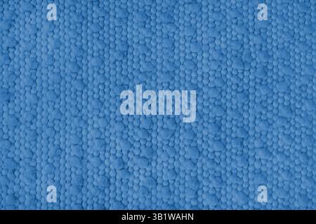 Textur von blauem Teppichgewebe mit grober Textur. Oberfläche, Struktur von Polstern oder Teppichmaterial, Stoffhintergrund Nahaufnahme, Makro. Stockfoto