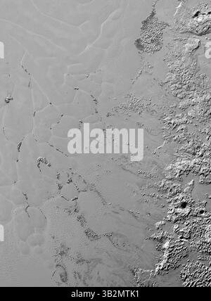 4. Februar 2016 - Weltraum - die Stickstoffeisgletscher auf Pluto scheinen eine faszinierende Ladung zu transportieren: Zahlreiche, isolierte Hügel, die Bruchstücke von Wassereis aus dem umliegenden Hochland von Pluto sein könnten. Diese Hügel messen einzeln eine bis mehrere Meilen oder Kilometer, laut Bildern und Daten der NASA-Mission New Horizons. Die Hügel, die sich in der riesigen Eisebene befinden, die informell Sputnik Planum innerhalb von Plutos „Herz“ genannt wird, sind wahrscheinlich Miniaturversionen der größeren, durcheinander geworfenen Berge an der westlichen Grenze von Sputnik Planum. Sie sind ein weiteres Beispiel für Plutos faszinierende und reiche geologische Vielfalt Stockfoto
