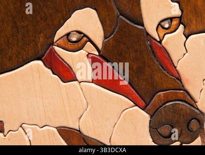 Teil des Puzzles in Form eines Wolfskopfes. Stockfoto