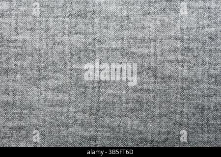 Wunderschöner, salbeigrauer Stoff als Hintergrund, Nahaufnahme. Textur aus grauem Baumwollgewebe. Graues Nylon im Hintergrund. Stockfoto