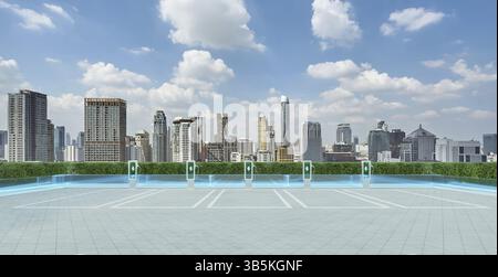 Leerer Parkplatz mit EV-Ladestationen, die eine nachhaltige Verkehrslösung vor einem modernen Stadtbild bieten. 3D-Rendering Stockfoto