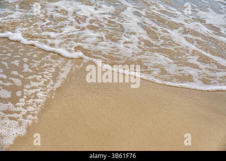 Nahaufnahme von Sand und Meer Surf in Punta Allen, Mexiko Stockfoto