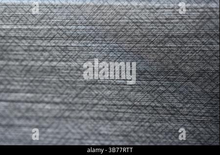 Klassischer Calico Stoff, hellgrau, Hintergrund, strukturiert. Nahaufnahme mit grauem Texturhintergrund. Stockfoto