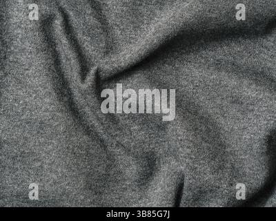 Grau Baumwollstoff Textur. Kleidung aus Baumwolle Jersey Hintergrund mit Falten Stockfoto