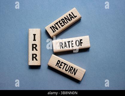 IRR - Internal Rate of Return symbol. Concept word IRR on wooden cubes. Beautiful grey background. Business and IRR concept. Copy space. Stockfoto