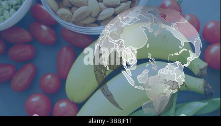 Bild des Globus über Obst und Gemüse, das auf dem Tisch liegt Stockfoto