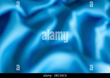 Abstrakte blaue Stoffstruktur mit weichen Falten für einen beruhigenden Hintergrund Stockfoto