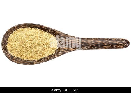 Goldenes Flachsmahl auf einem Holzlöffel isoliert auf weiß Stockfoto