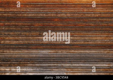 Die Textur alter abgenutzter Holzläden als Hintergrund Stockfoto