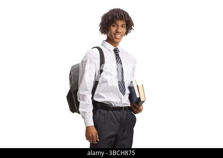 afroamerikanischer Student in Uniform, der Bücher isoliert auf weißem Hintergrund hält Stockfoto